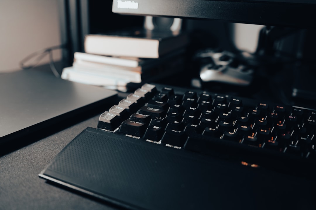 a-computer-keyboard-sitting-on-top-of-a-desk-epwdhkngijg